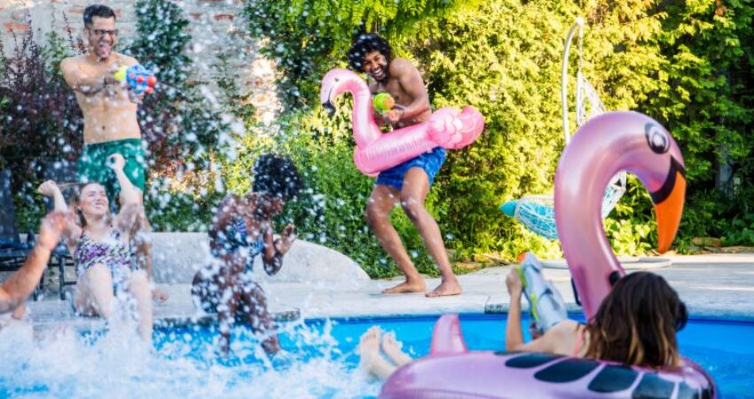 The friends are thrilled to play Watergun while in the pool.