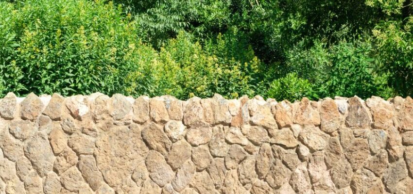 A stone wall fence.