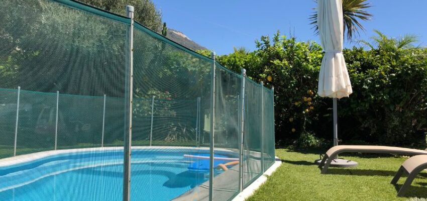 A mesh pool fence has the best aesthetics and can keep your pet away from the pool.