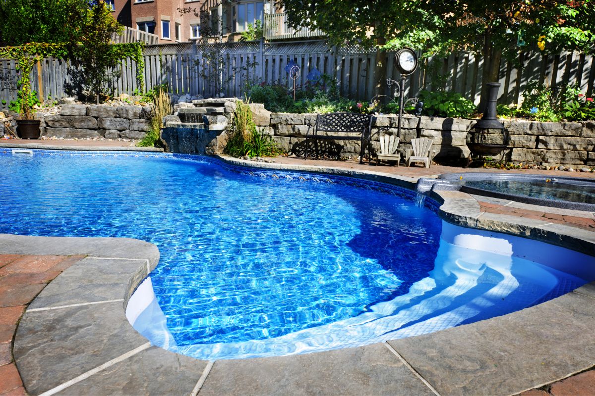 A pool that has a low-maintenance pool landscape design.