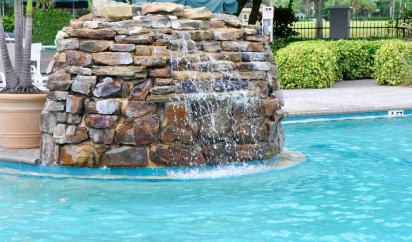Enhance your poolside landscape with a combination of fire features and water elements.