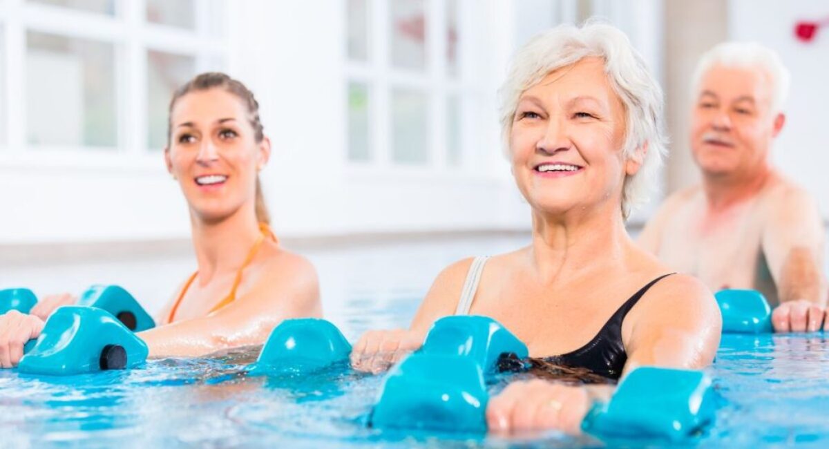 Seniors are having fun while exercising in the pool.