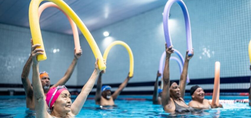 Seniors have fun while exercising regularly in the pool.