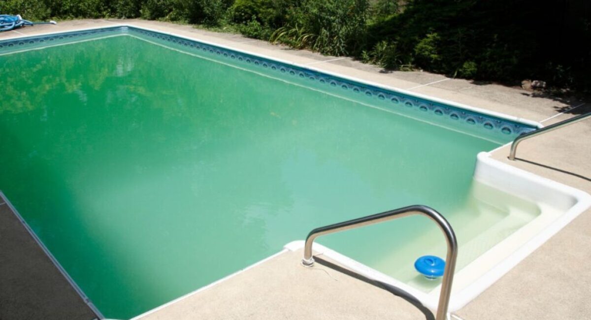 A pool with cloudy pool water.