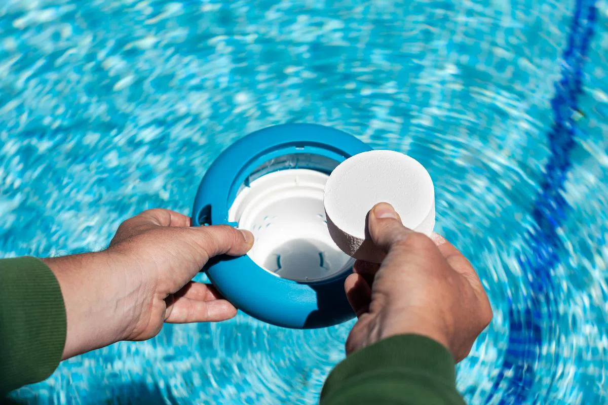 chlorine-alternatives-for-pool (1) The pool owner places chlorine tablets in the skimmer basket.