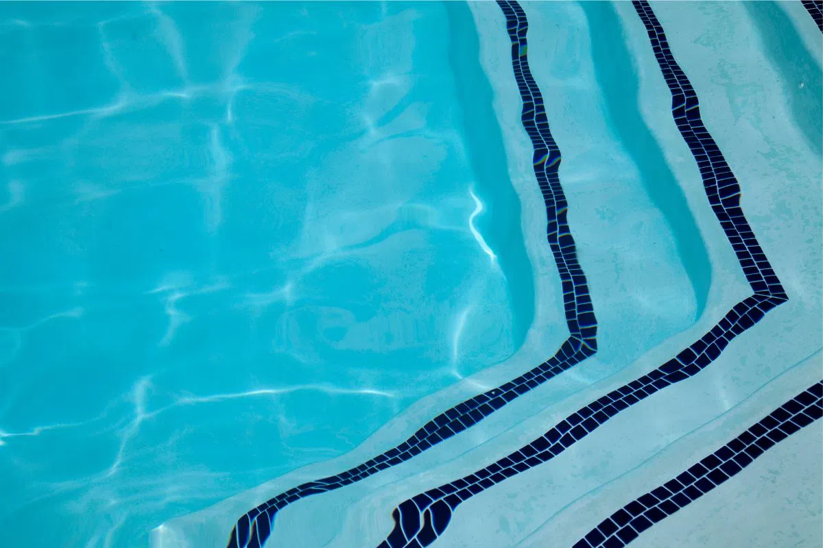 Swimming pool deck tiles need to be durable and non-slip, while waterline tiles should resist buildup and add visual flair.