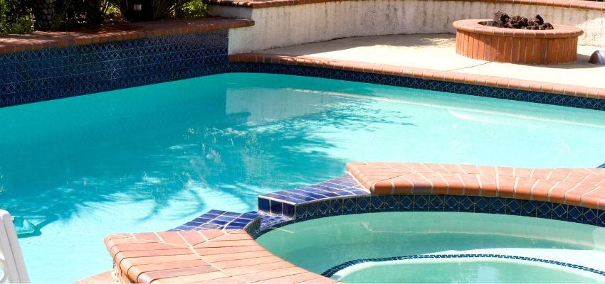 The hot tub and swimming pool water need different amounts of chlorine and have different chemicals. Additionally, they have different temperatures. There are chemicals required in pool water that might not be safe for use in a hot tub.