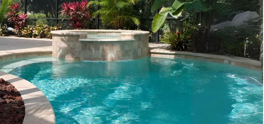 An inground pool hot tub combo.