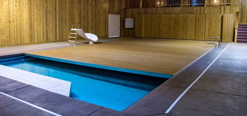 poolCovers can walk on (2) The pool features movable floors that turn into a patio when the pool is not in use.