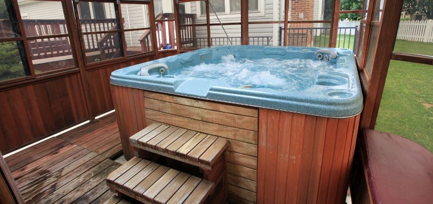 An outdoor hot tub with steps
