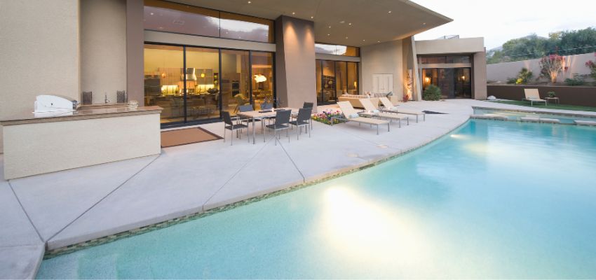 Lounging areas and outdoor furniture enhance functionality and comfort in the pool area.