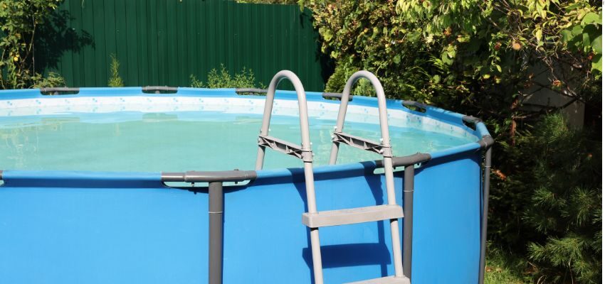 The backyard has an above-ground pool with a deep end.