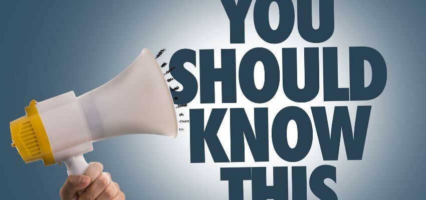 The person using a megaphone says, "You should know this."