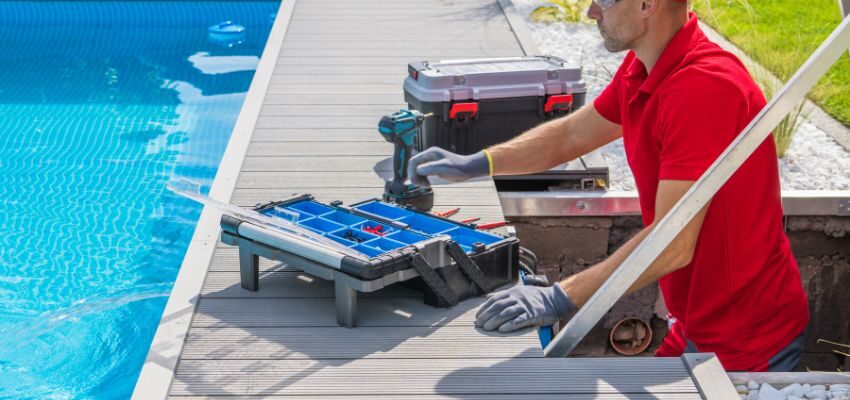 A technician fixing a pool