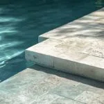 Concrete pavers around the pool can make this dream a reality, providing a lasting, visually appealing area that transforms any outdoor space.