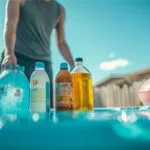 The man prepares all the chemicals needed for the above ground pool.